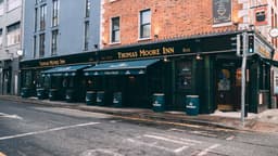 Thomas Moore Inn logo