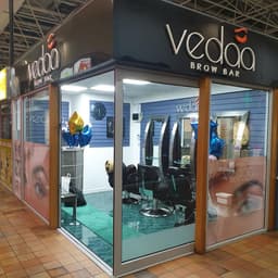 Vedaa Brow and Beauty Bar logo