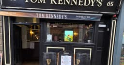 Tom Kennedy's Bar logo