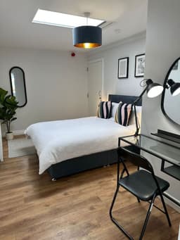 Ocho Homes Lux by Eight Continents - Cave Hill Room logo