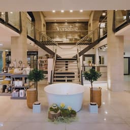 Versatile Bathrooms + Tiles logo