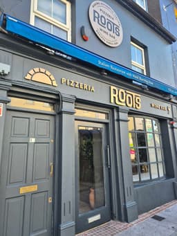 Roots Pizzeria & Wine Bar logo