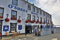 O'Shea's Hotel...by the sea logo