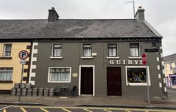 Guiry's Bar logo