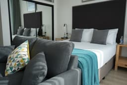 The James Suites logo